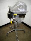 Used Key International Tablet Deduster, Model TD-101, 304 Stainless Steel. Air volume 1 to 2 cfm, vacuum 20 to 30 cfm. 115 volt. Mounted on stand with casters.