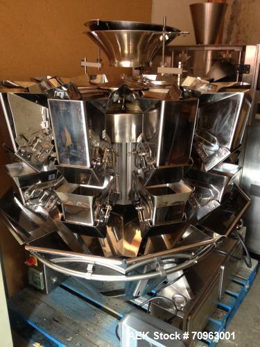 Used Combi Scale 10 Head Scale.  Stainless steel smooth bucket.  Rated up to 140 cycles per mnute.  Includes controls.