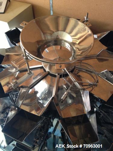 Used Combi Scale 10 Head Scale.  Stainless steel smooth bucket.  Rated up to 140 cycles per mnute.  Includes controls.
