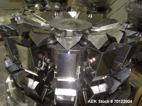 Used Ishida CCW-M-214W-S/30-PB High Speed Chute Unit, up to 120 bpm capable. Special "V" style radial feeder pans for increased accuracy at smaller target weights. Manufactured 2000.