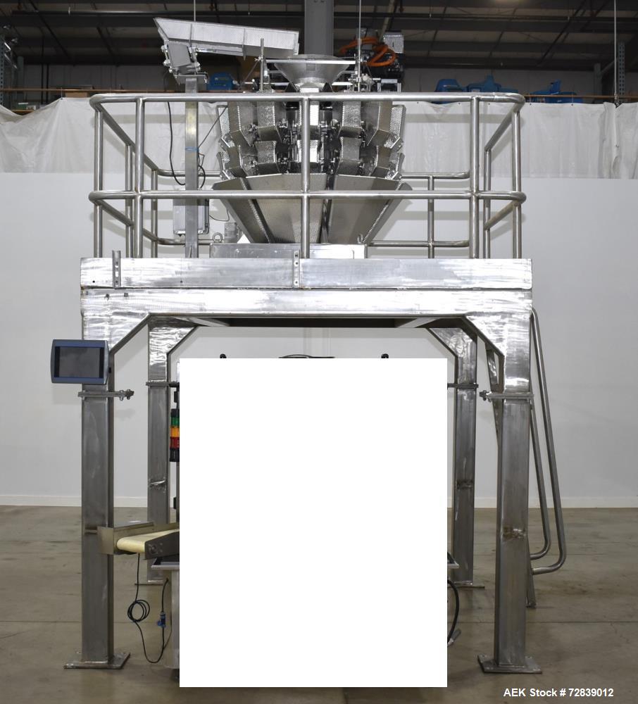 Used Ohlson Model 14-2C-18F Radial Combination Scale and Platform. 14-Dimple buckets. Weighing range approcimate 10 - 3000g. Max cycle speed 130 WPM. Has Syntron BF-2-B magnetic feeder. Serial# 88160...
