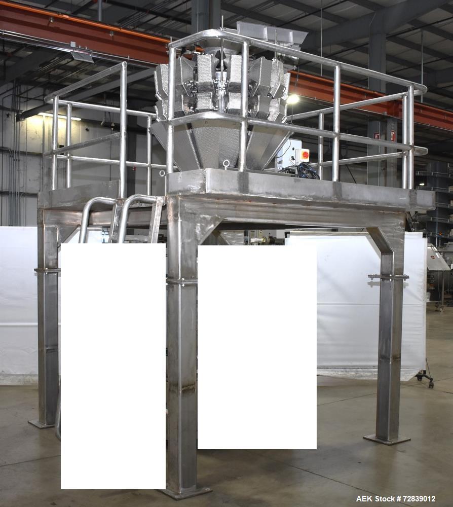 Used Ohlson Model 14-2C-18F Radial Combination Scale and Platform. 14-Dimple buckets. Weighing range approcimate 10 - 3000g. Max cycle speed 130 WPM. Has Syntron BF-2-B magnetic feeder. Serial# 88160...