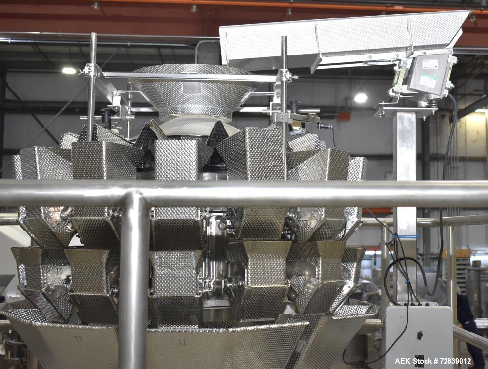 Used Ohlson Model 14-2C-18F Radial Combination Scale and Platform. 14-Dimple buckets. Weighing range approcimate 10 - 3000g. Max cycle speed 130 WPM. Has Syntron BF-2-B magnetic feeder. Serial# 88160...