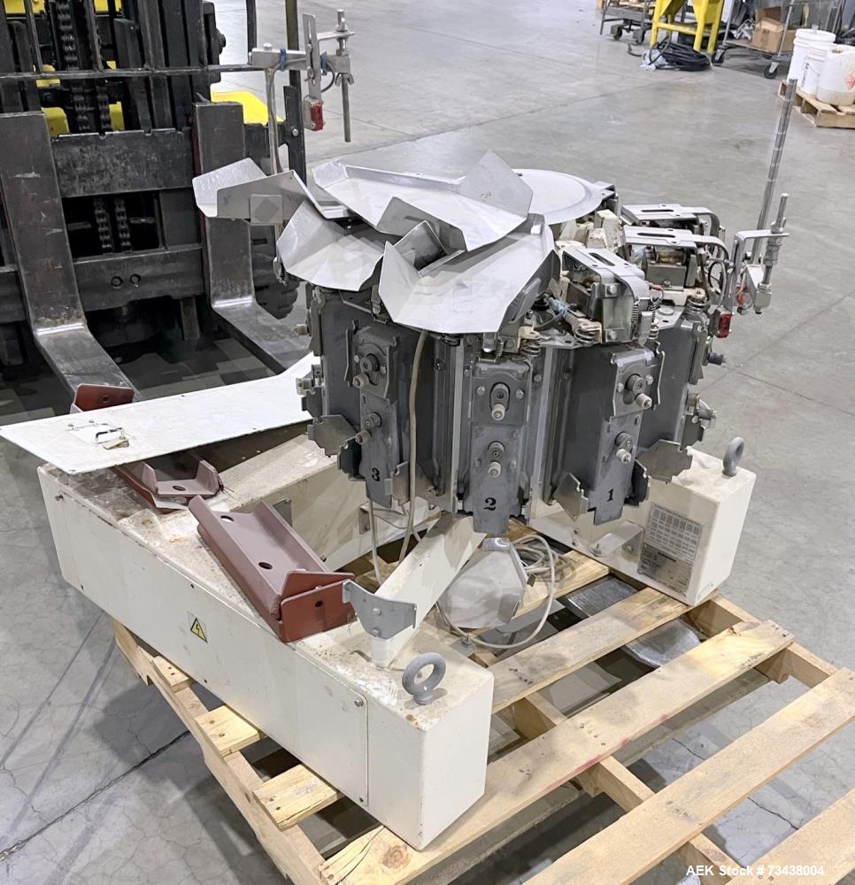 Used Yamato Scale Model ADW-510-A, 10 Head Scale with 3 liter buckets. Maximum speed up to 70 per minute. Weight range 4 - 500 gram. Serial# WG980674. 1/60/230 Volt.