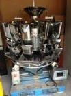Used Combi Scale 10 Head Scale.  Stainless steel smooth bucket.  Rated up to 140 cycles per mnute.  Includes controls.