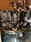 Used Combi Scale 10 Head Scale.  Stainless steel smooth bucket.  Rated up to 140 cycles per mnute.  Includes controls.