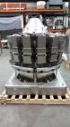 Used Ishida CCW-NZ-214W-S/70-WP. Fully wash down with dimpled buckets and chutes. Perfect for any products like, lettuce, beef jerky, vegetables, sausage patties, gummies, etc... Scale has a timing h...