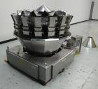 Used Ishida 16 Head Computer Weigher, Model CCW-Z-216W-S/20-WP, Serial 19102, Year 1992.  208 Volt, 60 hz, 10.9 amps, stainless steel contact parts.  Smooth buckets.