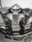 Used Ishida 16 Head Computer Weigher, Model CCW-Z-216W-S/20-WP, Serial 19102, Year 1992.  208 Volt, 60 hz, 10.9 amps, stainless steel contact parts.  Smooth buckets.