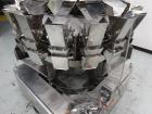 Used Ishida 16 Head Computer Weigher, Model CCW-Z-216W-S/20-WP, Serial 19102, Year 1992.  208 Volt, 60 hz, 10.9 amps, stainless steel contact parts.  Smooth buckets.
