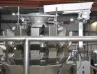 Used Ohlson Model 14-2C-18F Radial Combination Scale and Platform. 14-Dimple buckets. Weighing range approcimate 10 - 3000g. Max cycle speed 130 WPM. Has Syntron BF-2-B magnetic feeder. Serial# 88160...