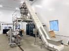 Used Ohlson (nVenia) Combination Scale Clamshell Packaging Line for Produce, Nuts or Microgreens. Capable of speeds up to 50 CPM. Line consists of Ohlson Model IC-18-8-SS S/S cleated belt infeed conv...