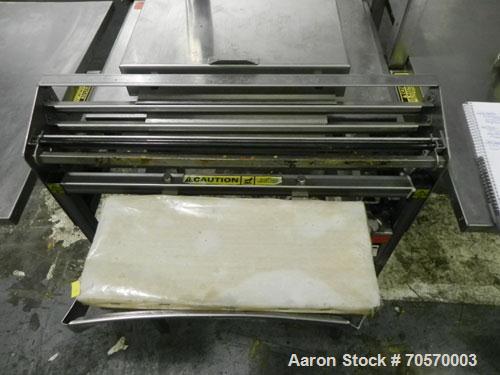Used Mettler-Toledo Model 662 StepSaver Manual Weigh-Wrap Center. Consists of a SmartTouch Readout, model 8270 scale, stainless steel platform, capacity 50 x .01 pounds, model 317 label printer, labe...