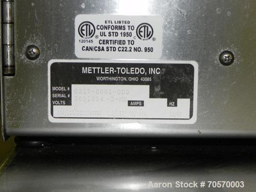 Used Mettler-Toledo Model 662 StepSaver Manual Weigh-Wrap Center. Consists of a SmartTouch Readout, model 8270 scale, stainless steel platform, capacity 50 x .01 pounds, model 317 label printer, labe...