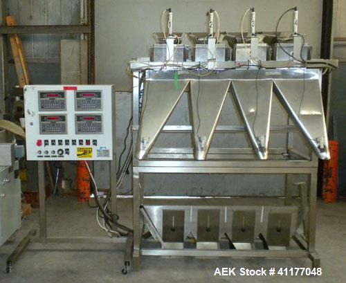 Used Weigh Right PMB-4 net weigher is a four-head scale offering speeds up to 40 fills per minute. Approximately 3-1/2" outlets on 18" centers with a 40" discharge height. The scale is designed to ha...