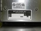 Used Mettler-Toledo Model 662 StepSaver Manual Weigh-Wrap Center. Consists of a SmartTouch Readout, model 8270 scale, stainless steel platform, capacity 50 x .01 pounds, model 317 label printer, labe...