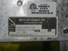 Used Mettler-Toledo Model 662 StepSaver Manual Weigh-Wrap Center. Consists of a SmartTouch Readout, model 8270 scale, stainless steel platform, capacity 50 x .01 pounds, model 317 label printer, labe...
