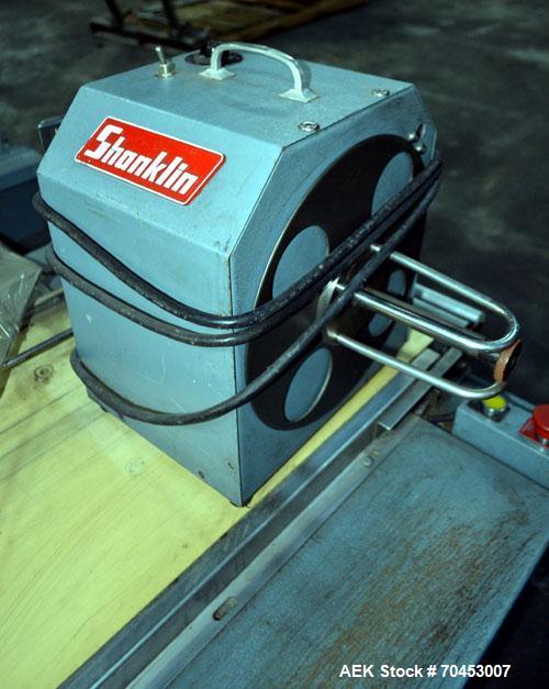 Unused- Shanklin Automatic L Bar Sealer, Model A27A. Capable of speeds up to 35 packages per minute. Has package size range: length 4" to 33", width up to 21", height up to 8". Maximum film size of 3...
