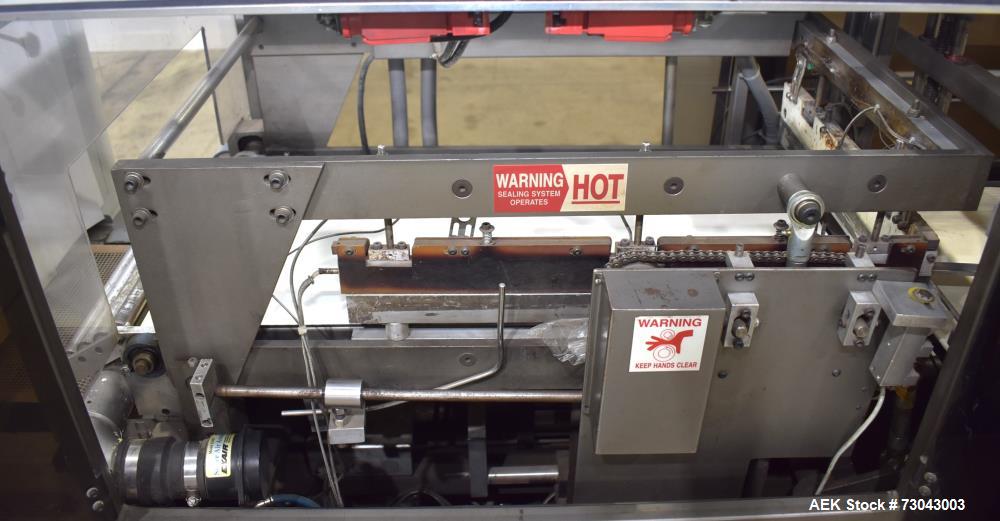 Used- TPA Model 1000 Automatic L-Bar Shrink Wrapper with Texwrap Model T1322 Shrink Tunnel. Wrapper has approximate 19"W x 2...