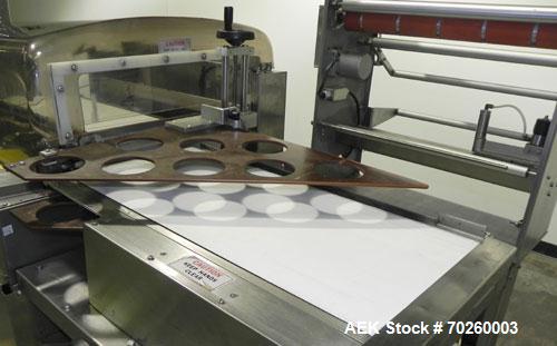 Used Weldotron 5962 Stainless Steel Automatic L-bar Sealer capable of speeds up to 25 packages per minute. Has an 18" wide x 22" long seal area with a maximum package height of approximately 6". Pnue...