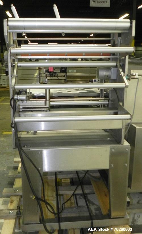 Used Weldotron 5962 Stainless Steel Automatic L-bar Sealer capable of speeds up to 25 packages per minute. Has an 18" wide x 22" long seal area with a maximum package height of approximately 6". Pnue...