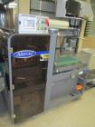 Used Arpac Model L-18 Automatic L-Bar Shrink Wrapper. Capable of speeds up to 40 packages per minute. Variable conveyor speed: 45 - 90 FPM. Product size range: (Width) 1-1/2