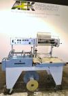 Used Conflex Model E-250C Automatic L Bar Sealer and Shrink Wrapper. Capable of speeds up to 35 packages per minute. Seal bar is 16