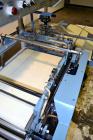 Used Conflex Model E-250C Automatic L Bar Sealer and Shrink Wrapper. Capable of speeds up to 35 packages per minute. Seal bar is 16
