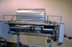 Used Conflex Model E-250C Automatic L Bar Sealer and Shrink Wrapper. Capable of speeds up to 35 packages per minute. Seal bar is 16