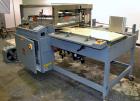 Used Shanklin A27A Automatic L bar Sealer capable of speeds up to 35 packages per minute.Has hot knife seal and a package size range:length 4