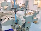 Used Shanklin M-22 Multi-Packer L-Sealer Shrink Wrapper with T6H Tunnel. Package speeds up to 25 bundles per minute (single stroke). Max seal area: 15