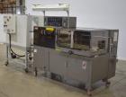 Used- TPA Model 1000 Automatic L-Bar Shrink Wrapper with Texwrap Model T1322 Shrink Tunnel. Wrapper has approximate 19