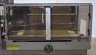 Used- TPA Model 1000 Automatic L-Bar Shrink Wrapper with Texwrap Model T1322 Shrink Tunnel. Wrapper has approximate 19