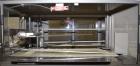 Used- TPA Model 1000 Automatic L-Bar Shrink Wrapper with Texwrap Model T1322 Shrink Tunnel. Wrapper has approximate 19