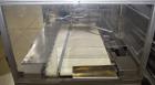 Used- TPA Model 1000 Automatic L-Bar Shrink Wrapper with Texwrap Model T1322 Shrink Tunnel. Wrapper has approximate 19