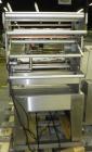 Used Weldotron 5962 Stainless Steel Automatic L-bar Sealer capable of speeds up to 25 packages per minute. Has an 18