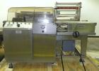 Used Weldotron 5962 Stainless Steel Automatic L-bar Sealer capable of speeds up to 25 packages per minute. Has an 18