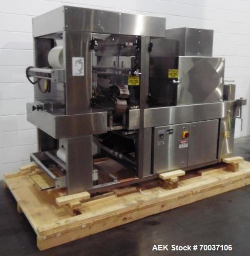 Used API Stainless Steel Pharmaceutical Shrink Bundler, Model Duratech 2000 S-PH. Integrated heat tunnel. Capable of up to 100 round or rectangular shaped containers depending on pattern and size. Si...