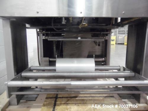 Used API Stainless Steel Pharmaceutical Shrink Bundler, Model Duratech 2000 S-PH. Integrated heat tunnel. Capable of up to 100 round or rectangular shaped containers depending on pattern and size. Si...