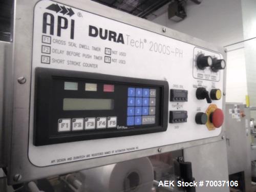 Used API Stainless Steel Pharmaceutical Shrink Bundler, Model Duratech 2000 S-PH. Integrated heat tunnel. Capable of up to 100 round or rectangular shaped containers depending on pattern and size. Si...