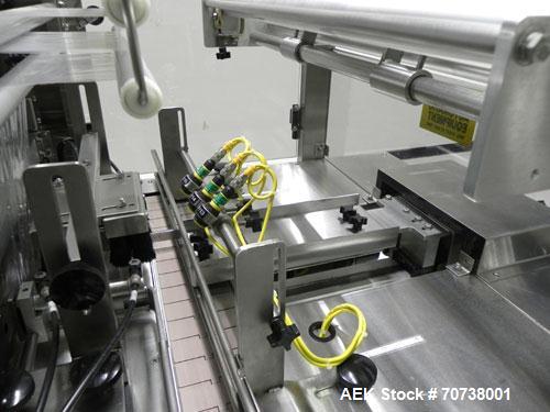 Used API Model DuraTech 2000-S-PH Pharmaceutical Shrink Bundler. Machine is capable of speeds up to 100 bottles/packages per minute (depending on pattern and size). Can handle containers up to 8" (he...