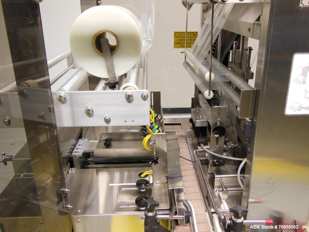 Used API Model DuraTech 2000-S-PH Pharmaceutical Shrink Bundler. Machine is capable of speeds up to 100 bottles/packages per minute (depending on pattern and size). Can handle containers up to 8" (he...