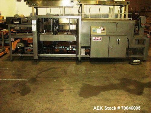 Used American Packaging Machinery (APM) Automatic Inline Shrink Bundler, Series MIF. Designed for trayed products. Capable of speeds up to 45 trays per minute. Intermittent motion unit with integrate...