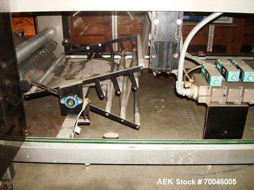 Used American Packaging Machinery (APM) Automatic Inline Shrink Bundler, Series MIF. Designed for trayed products. Capable of speeds up to 45 trays per minute. Intermittent motion unit with integrate...