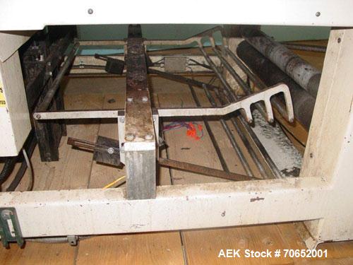 Used Arpac Model 105TW28 Shrink Wrapper with Film Feed Rack and Splicer. Speed up to 36 Wraps per Minute. 6' L x 20" W Roller Flight Infeed Conveyor with Pacing Gate. 28" Wide seal bar. Capable of ru...
