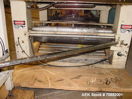 Used Arpac Model 105TW28 Shrink Wrapper with Film Feed Rack and Splicer. Speed up to 36 Wraps per Minute. 6' L x 20" W Roller Flight Infeed Conveyor with Pacing Gate. 28" Wide seal bar. Capable of ru...