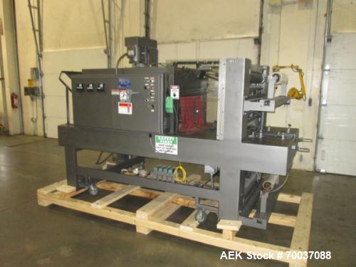 Used- Arpac, Model 55-28 Shrink Bundler with Heat Tunnel. Dual rolls with top and bottom film loading. 28" x 14" size range....