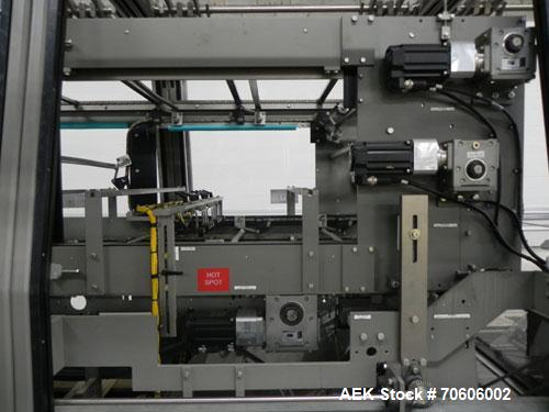 Used Douglas Contour Model M-75 Multi-Pack Shrink Bundler capable of speeds up to 75 cycles per minute. Now configured for print registered film, unsupported 8 oz and 11 oz bottles in multiple lanes,...