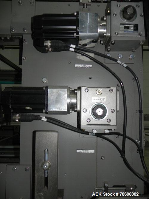 Used Douglas Contour Model M-75 Multi-Pack Shrink Bundler capable of speeds up to 75 cycles per minute. Now configured for print registered film, unsupported 8 oz and 11 oz bottles in multiple lanes,...
