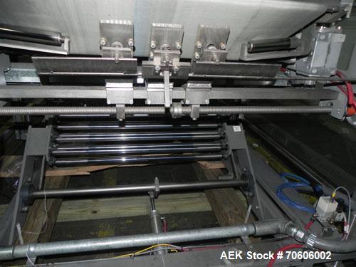 Used Douglas Contour Model M-75 Multi-Pack Shrink Bundler capable of speeds up to 75 cycles per minute. Now configured for print registered film, unsupported 8 oz and 11 oz bottles in multiple lanes,...
